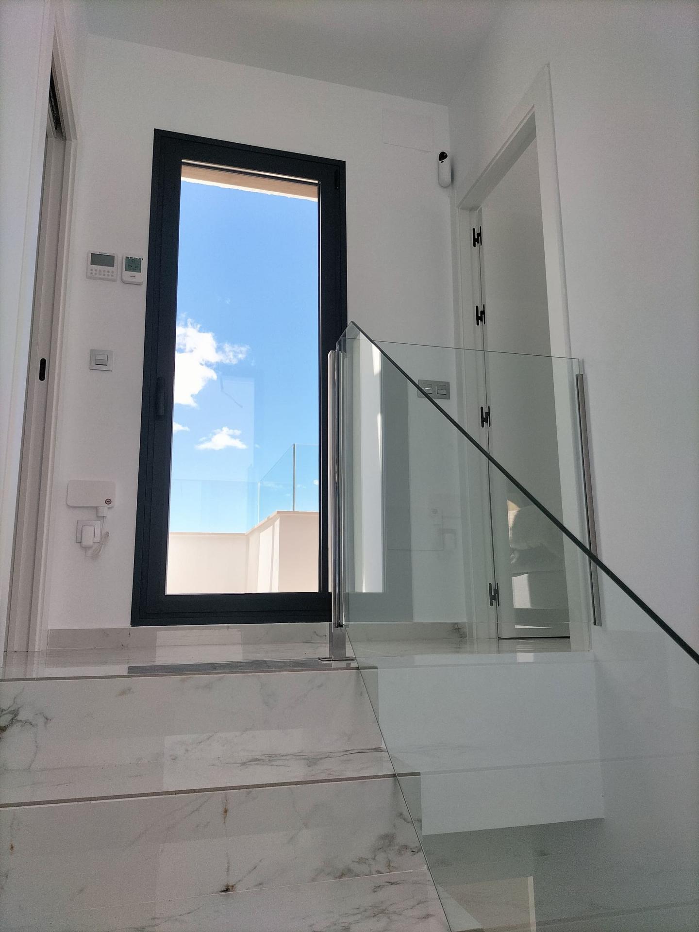 Communal pool from deck level, new-build development, Pinar de Campoverde