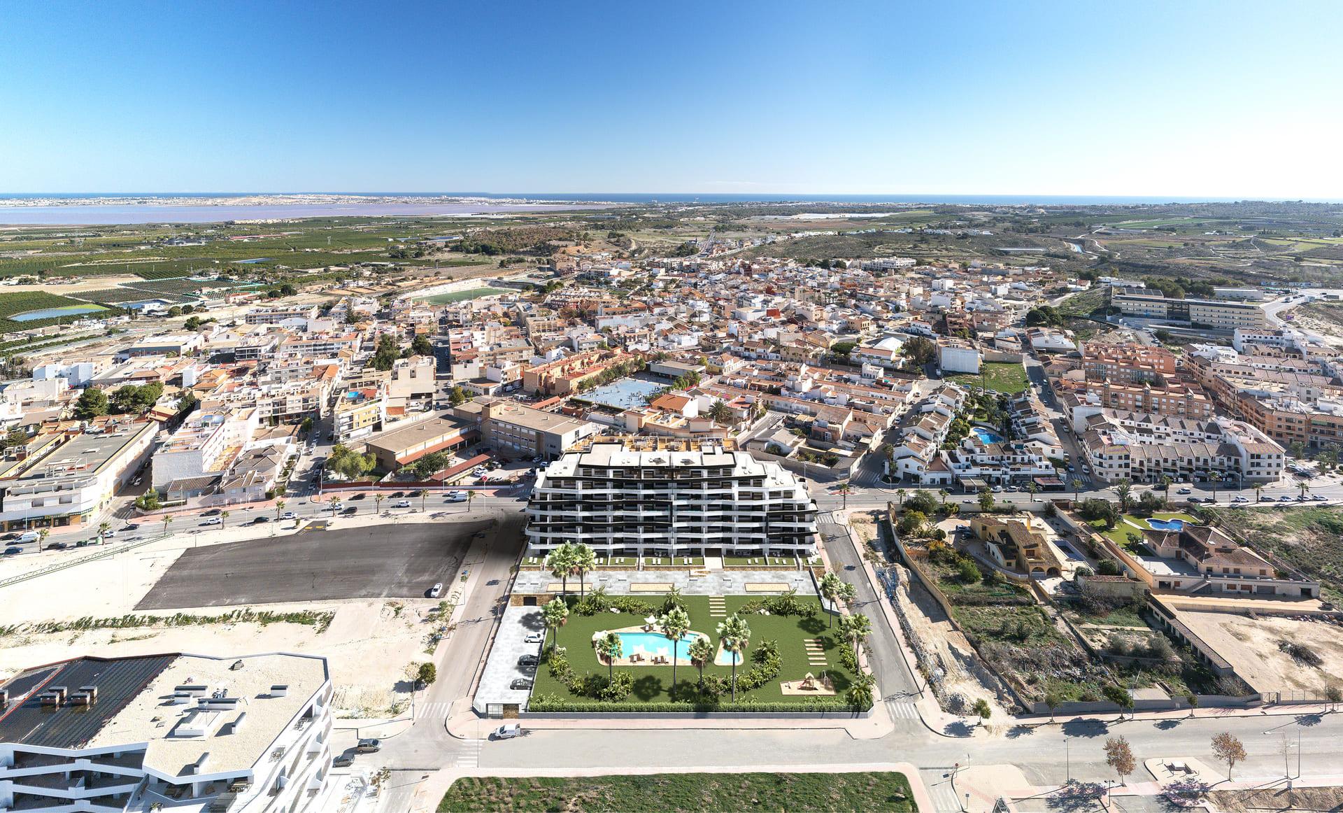 Building entrance and parking area, Pueblo 9, San Miguel De Salinas
