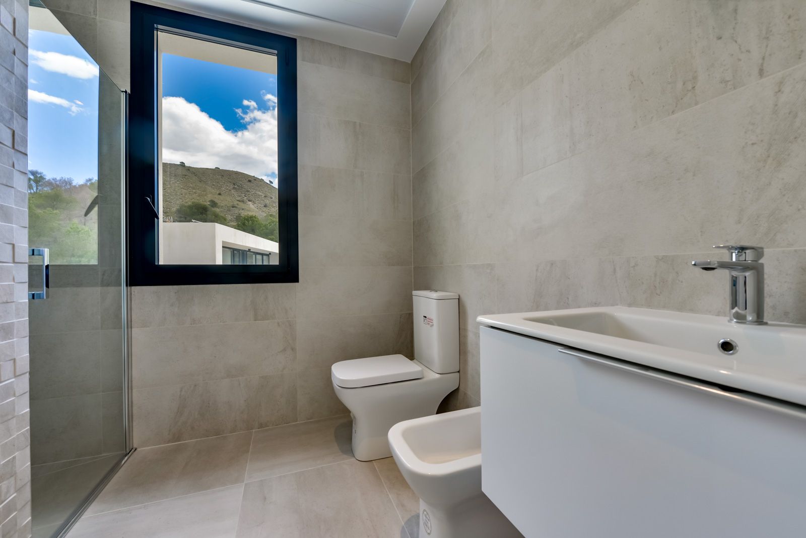 Outdoor shower area beside pool, new-build villa, Golf Bahía